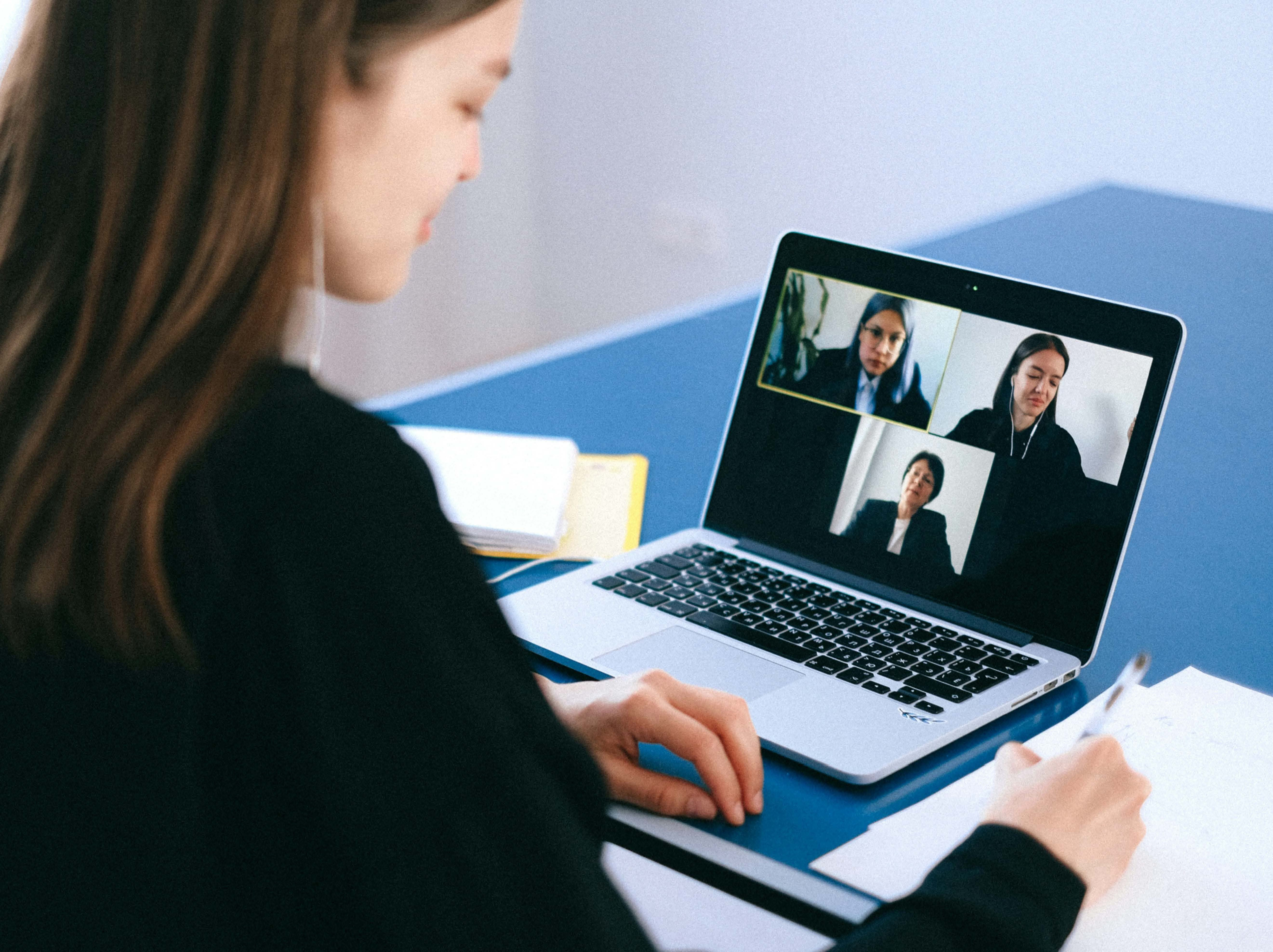 Compressed Woman at Computer on conference call